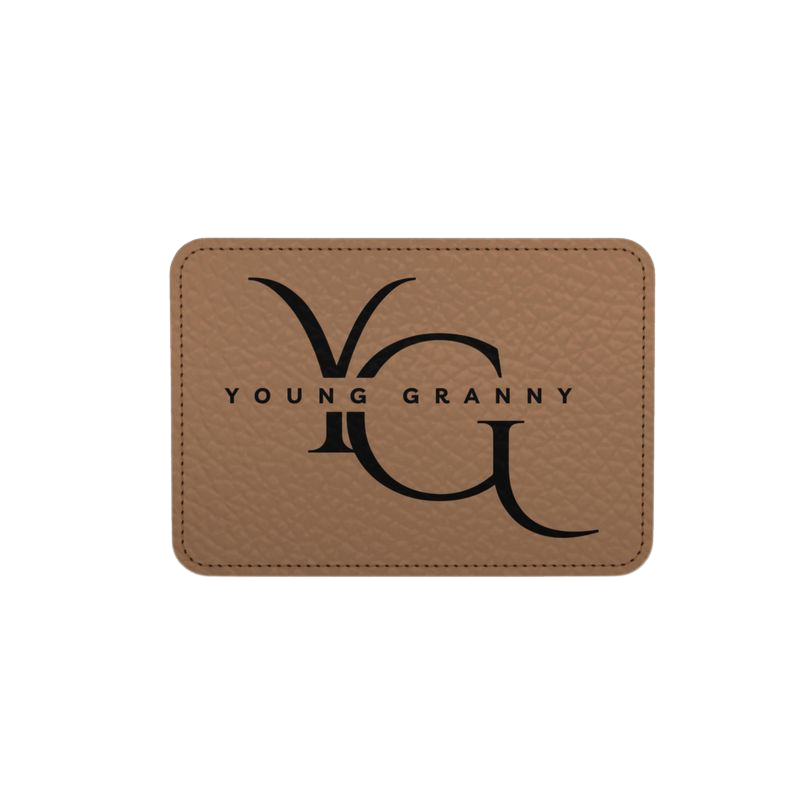 Tan leather patch with 'Young Granny' logo on brown small tote