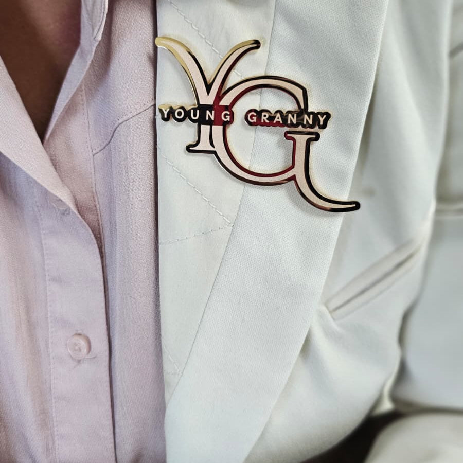 YG Wearing YG Rose Gold Brooch Up-Close
